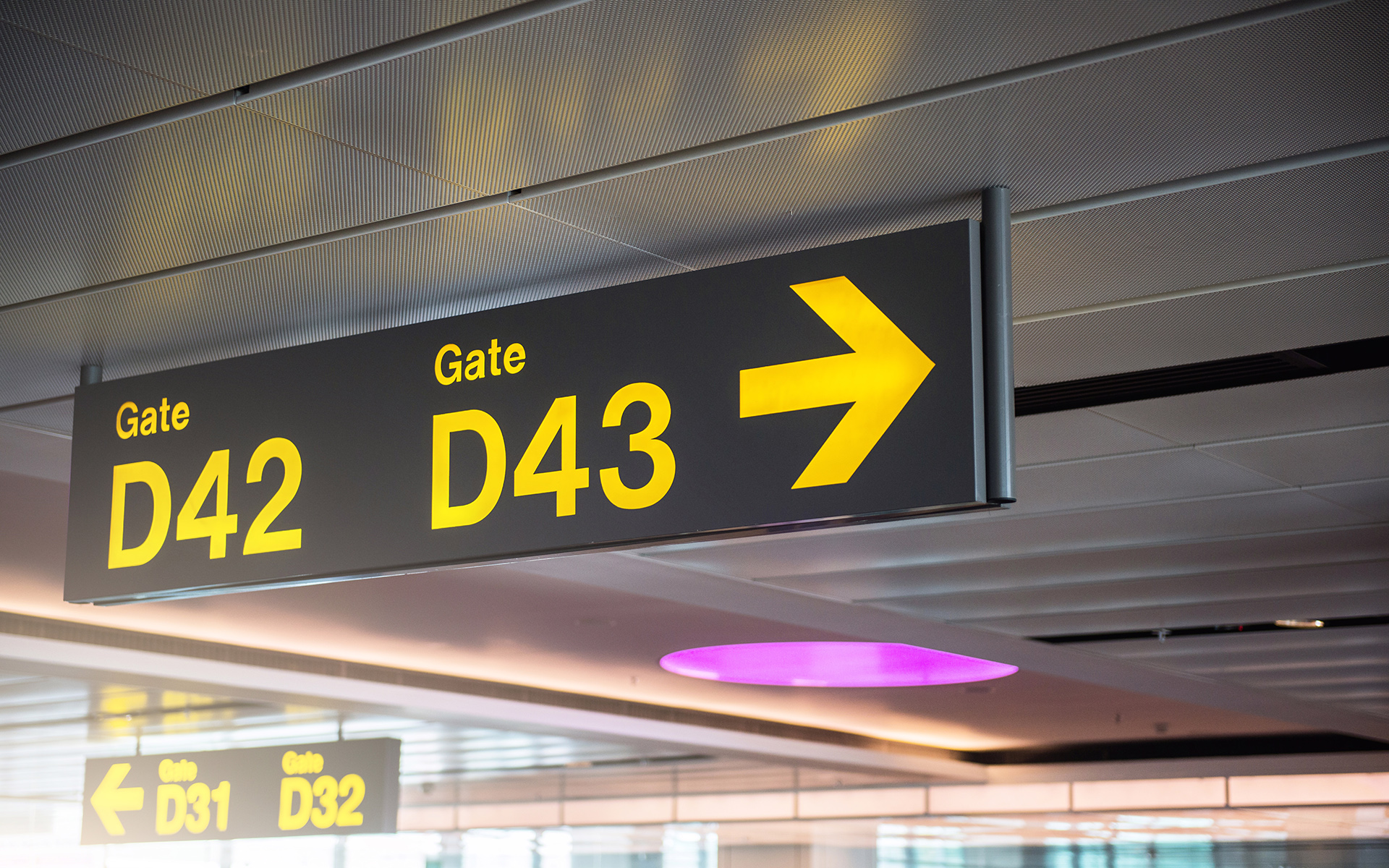 projecting signs; blade signs pointing to airport gates