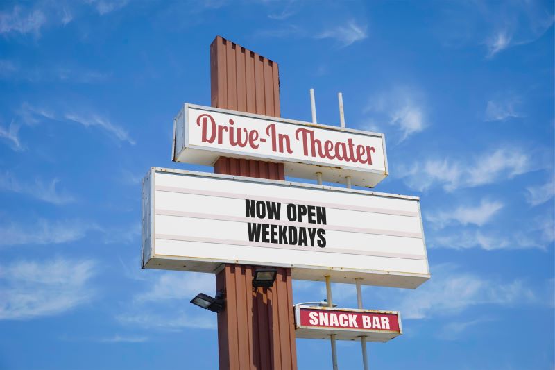 Drive-in theater freestanding pylon sign with message board